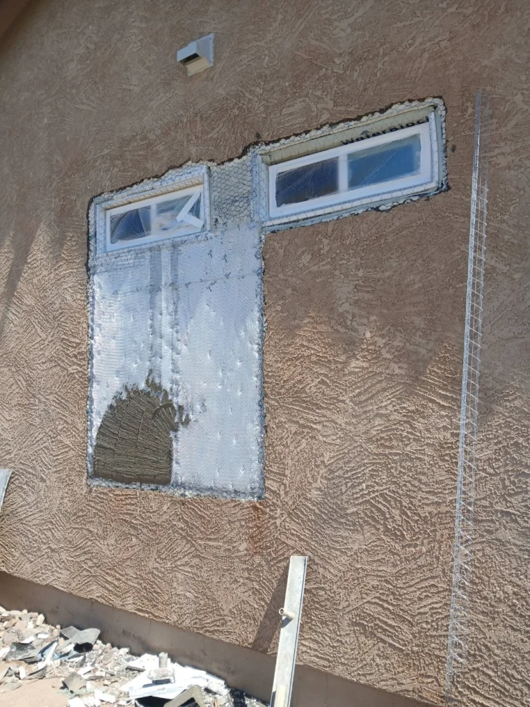 Stucco mesh repair around a window corner in Las Cruces